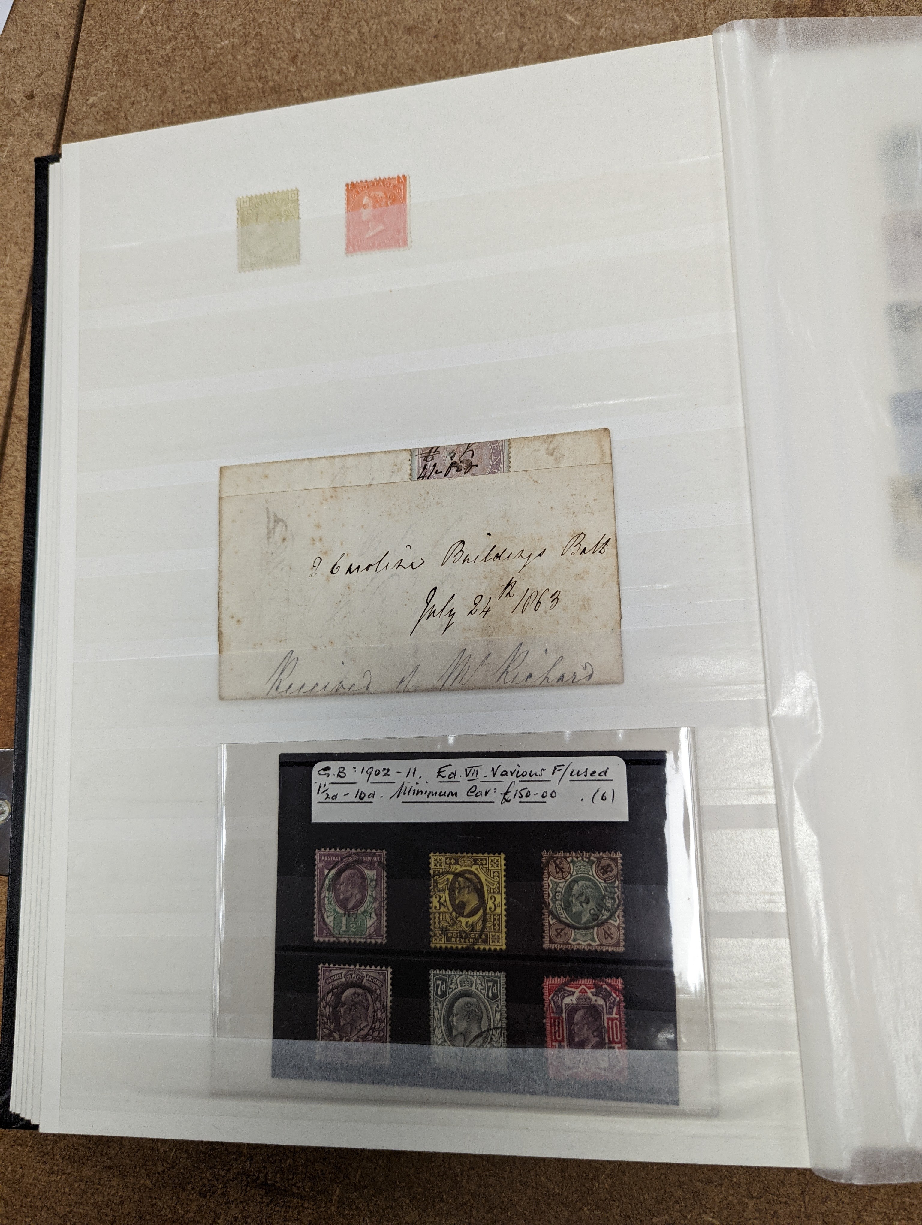 Great Britain stamps in stock book with 1840 1d black and 1841 2d blue unused. 1841 1d red brown mint block of 8, 1864-79 1d red plates in mint blocks including plate 79 block of 48, plate 170 block of 6 with marginal in